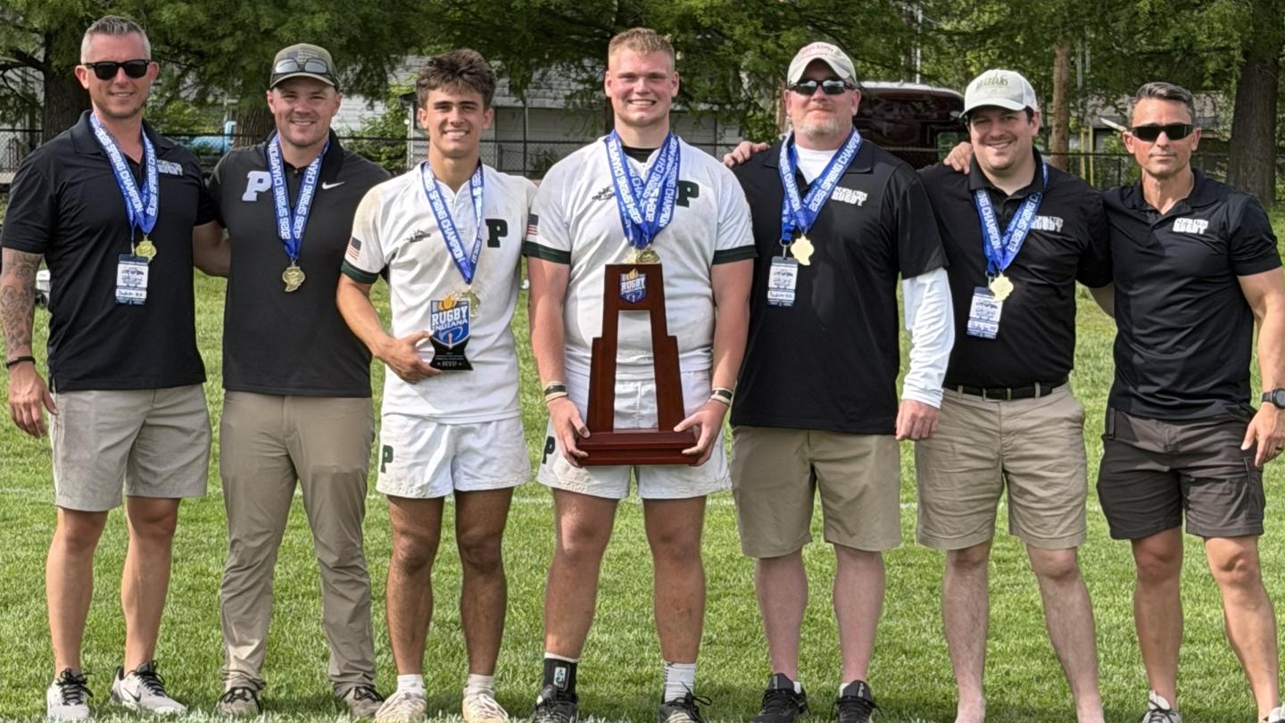 Pendleton captains and coaches with their trophy.