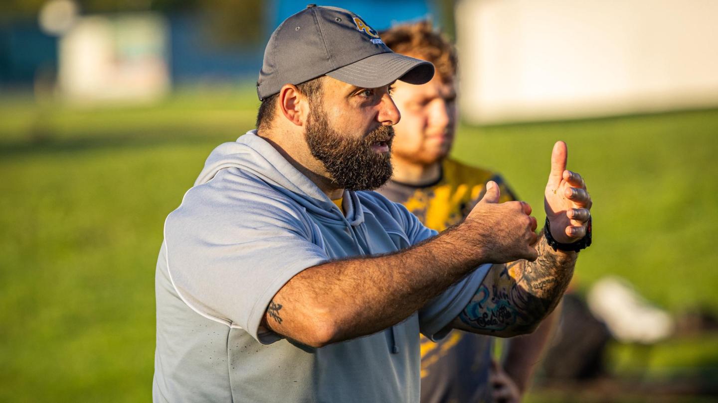 Sam Chaney shares his knowledge with a new group of Adrian players. Photo Lexi Klotz.
