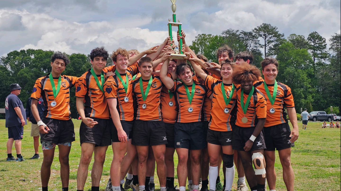 Charlotte Tigers hoist their 2026 North Carolina Club trophy.