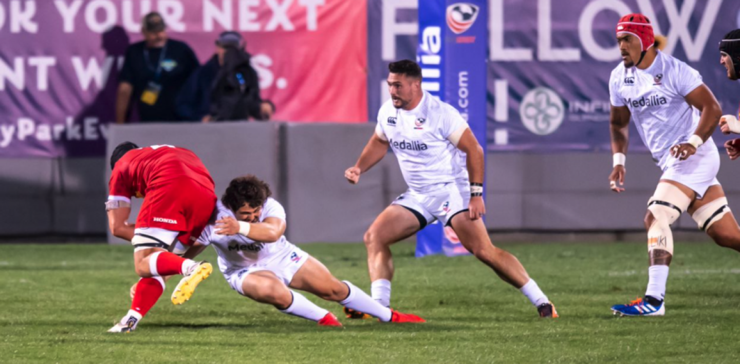 andrew guerra makes a tackle david barpal