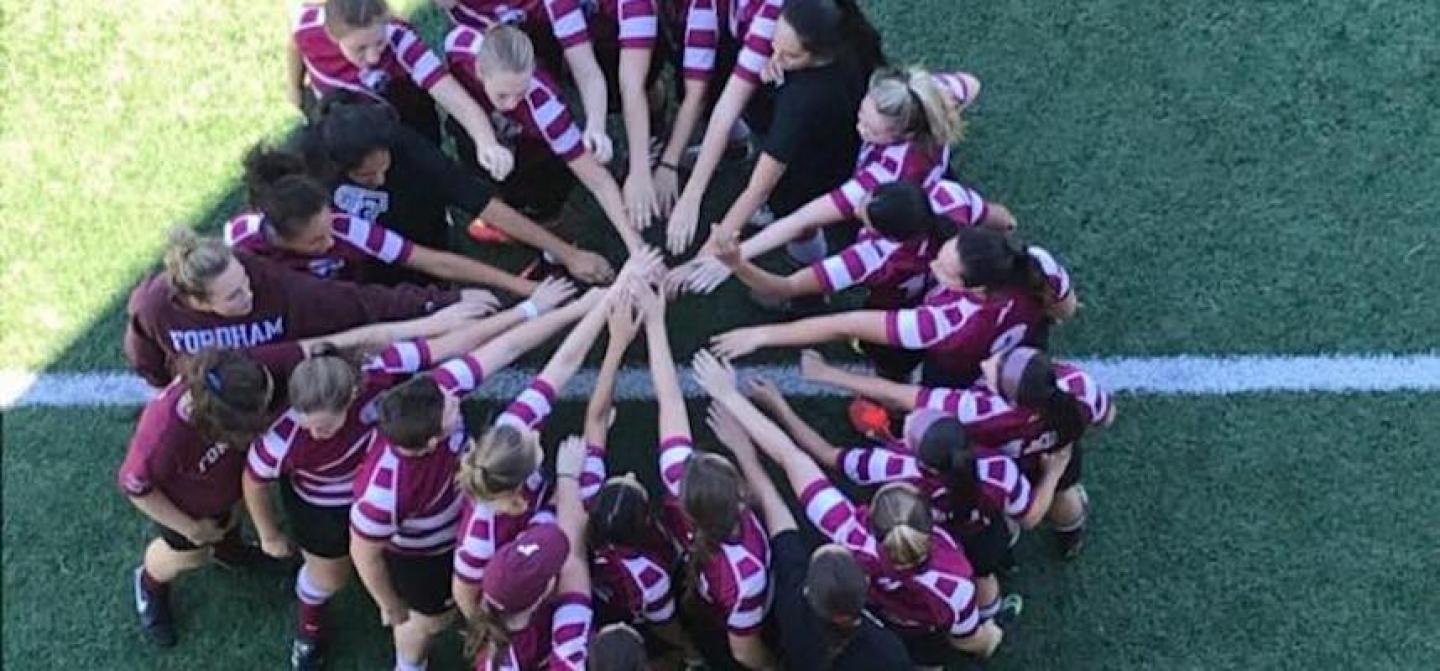 fordham women team huddle overhead